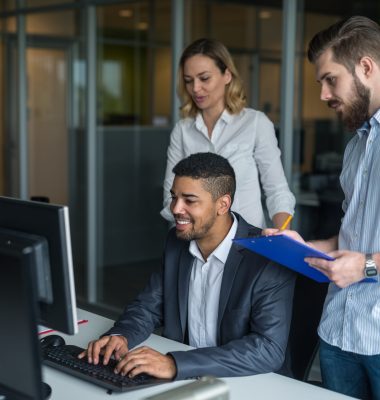 Team of business colleagues working together in an office.